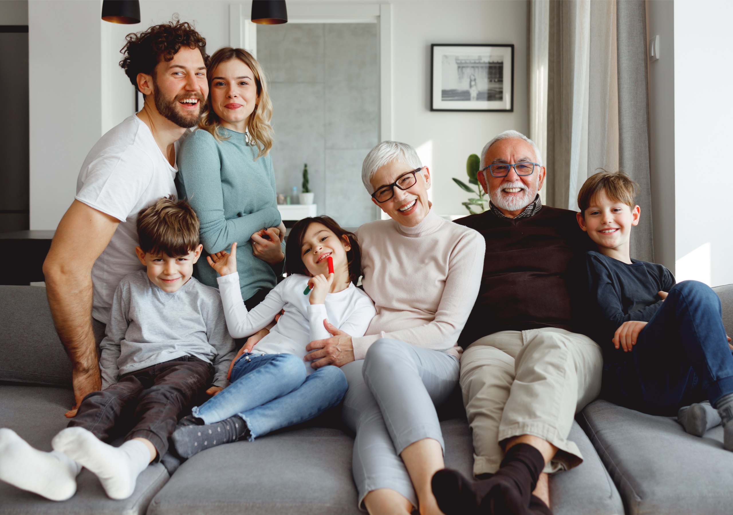 Large multi-generational family sitting on a couche together